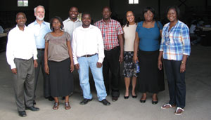 Two of the authors and a U.S. Census Bureau employee with their colleagues on the Zambian PES team