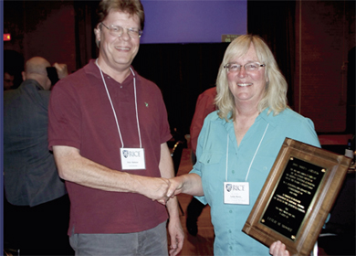 On March 22, San Antonio Chapter Vice President Peter Olofsson (left) presented the Don Owen Award to Leslie M. Moore for her outstanding contributions to research, statistical consultation, and service to the statistical community. 