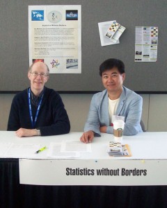 Statistics Without Borders (SWB) volunteers Ed Gracely (Drexel University) and Asaph Young Chun (U.S. Census Bureau) staff the SWB informational table at JSM 2012.