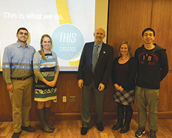 David Morganstein stands with students who attended a talk he gave to the Boston Chapter of the ASA in 2015.