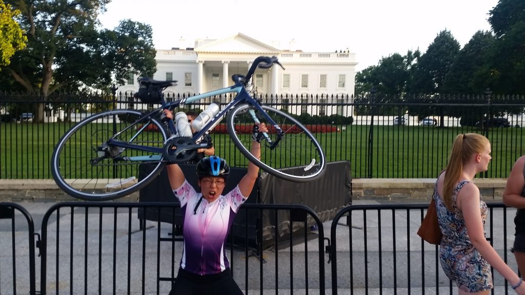 Bowen, after a day of training for the Ironman, hulks in front of the White House.