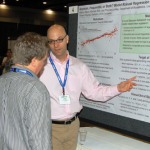Adam Szpiro presents the poster, "Bayesian, Frequentist, or Both? Model-Robust Regression and the 'Sandwich' Estimator."
