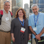 From left: Leonard Stefanski, Martha Gardner, and Terry Speed take time to enjoy the view of Vancouver while attending a reception at the Fairmont Waterfront Hotel.