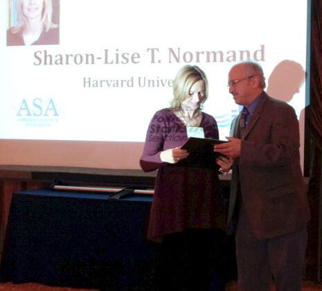 Sharon-Lise Normand receives one of two Long-Term Excellence Awards from Alan Zaslavsky, who was the previous awardee.