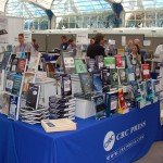 Attendees at the CRC Press booth at the JSM Expo at the San Diego Convention Center.