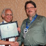 Gary Shapiro (left) accepting plaque of appreciation as outgoing chair of SWB from Jim Cochran