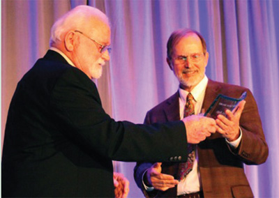 Karl Peace (left) accepts the Sellers-McCroan Award, presented by Wade Sellers.