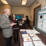 Genevera Allen explains her research to National Science Foundation Division of Mathematical Sciences Director Michael Vogelius.