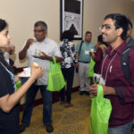 Naveen Narisetty of the University of Michigan (right) is sharing his thoughts with Chaitra Nagaraja of Fordham University.