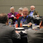 ASA leaders (foreground from left) Bob Rodriguez, Bill Smith, (middleground from left) Ray Waller, Jon Kettenring, Sastry Pantula, (background from left) Judith O'Fallon, Lynne Billard, and Michael O'Fallon reminisce at a JSM breakfast.