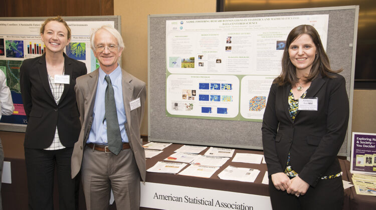 From left: SAMSI collaborator Jessi Cisewski of Carnegie Mellon University, SAMSI Director Richard Smith, and SAMSI postdoc Kimberly Kaufeld stand in front of the ASA’s poster during the Capitol Hill Exhibition of the Coalition for National Science Funding.