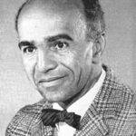 A Black man in a suit and bowtie