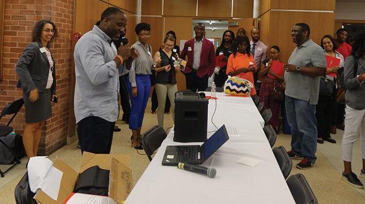Conference participants surround Adrian Coles, a statistical research scientist at Duke Clinical Research Institute, during StatFest.