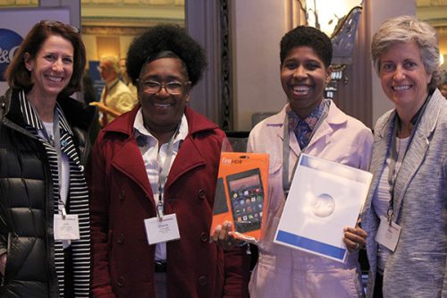 Emma Benn wins the Procter and Gamble raffle a fire tablet. From left Julie Grender and Dionne Swift of Procter and Gamble, Emma Benn and Phyllis Hoke