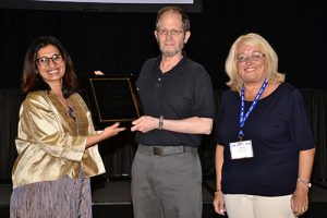 Bhramar Mukherjee (left) and Alicia Carriquiry present Paul R. Rosenbaum (University of Pennsylvania) with the Fisher Award and Lectureship. Photo by Eric Sampson/ASA