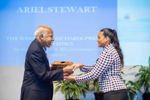 Winston Richards (left) returned to his birthplace of Trinidad in October to award the Winston A. Richards Prize in Statistics to Ariel Stewart. Ariel had the best II and III performance in statistics.