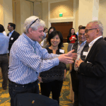 John Loewy, Honghong Zhou, Jian Zhu, and L.J. Wei talk animatedly during the NERDS Workshop.