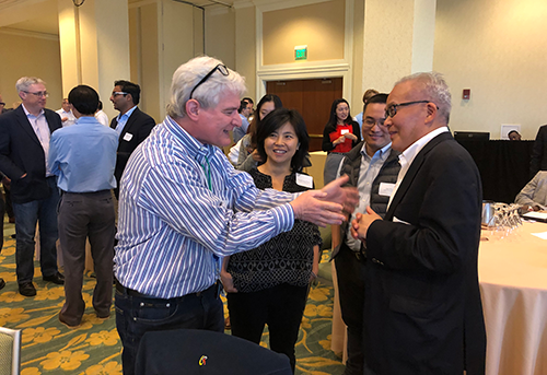 John Loewy, Honghong Zhou, Jian Zhu, and L.J. Wei talk animatedly during the NERDS Workshop.
