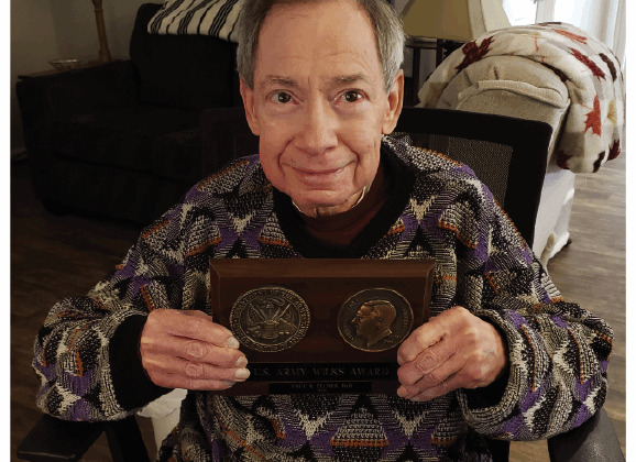 Paul M. Ellner holds his US Army Wilks Award