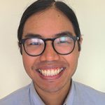 Photo of Edward Wu, the ASA's 2021 science policy fellow, an Asian man with a big smile and round, black-framed glasses.