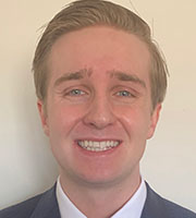 A photo of Andrew Furlong, a white male with sandy hair, smiling.