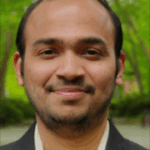 Photo shows Siddhesh Kulkarni, a smiling Southeast Asian man with tan skin