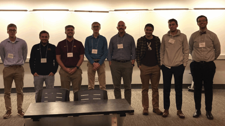 Meredith Wills with the SportsMedia Technology data challenge finalists. From left: Cameron Grove, Durham University (UK); Jack Rogers, University of Minnesota; Kai Franke, University of Minnesota; Jackson Balch, University of Minnesota; Isaac Blumhoefer, University of Minnesota; Cale Williams, Georgia Institute of Technology; Ethan Rendon, New York University; Jack Weyer, University of Southern California; Billy Fryer, North Carolina State University; and Meredith J. Wills, SportsMedia Technology