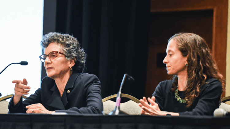 Sherry Glied gives the opening keynote. From left: Sherry Glied and Elizabeth Stuart.