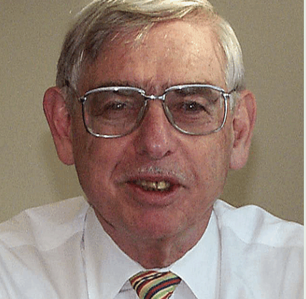 Jerome Sacks, white shirt, striped tie, glasses.