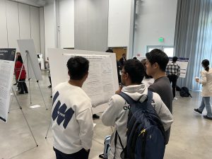 Students view a poster at the Georgia Tech event. 
