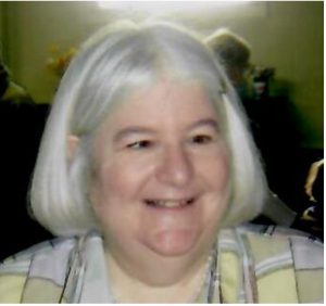 Photo of Carol, gray hair, big smile