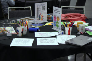 Image of the GivesBack table with crayons and coloring pages.