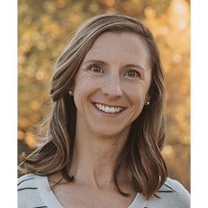 Portrait of Bailey Fosdick, a smiling white woman with shoulder-length blond hair