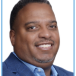 Black man, big smile, short hair