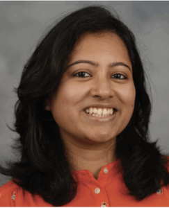 Portrait of Sen, female, big smile, long wavy hair