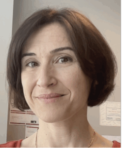 Portrait of Staicu, chin length bob, warm eyes, slight smile