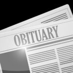 Newspaper reading obituary