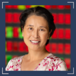 An Asian woman in a floral shirt in front of a red and green background