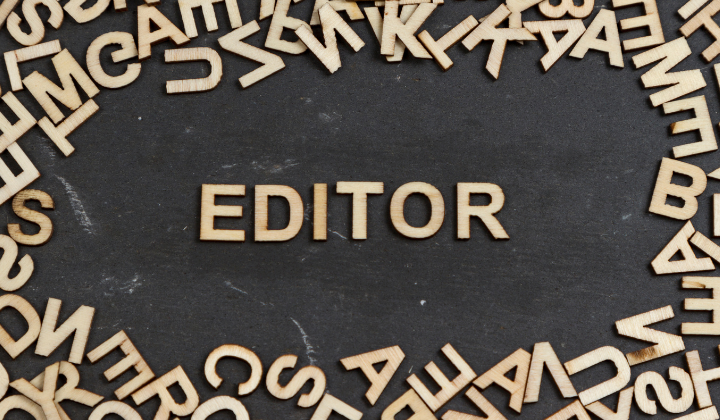 The word EDITOR surrounded by wooden letters