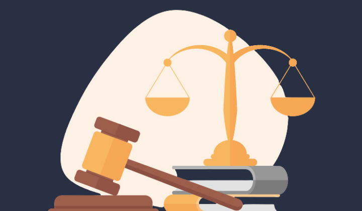 Gavel and a set of scales hanging from a center beam