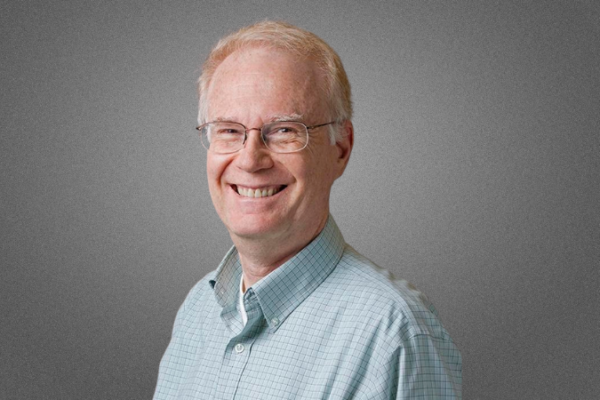 Photo of Barry, light blond hair, glasses, big smile