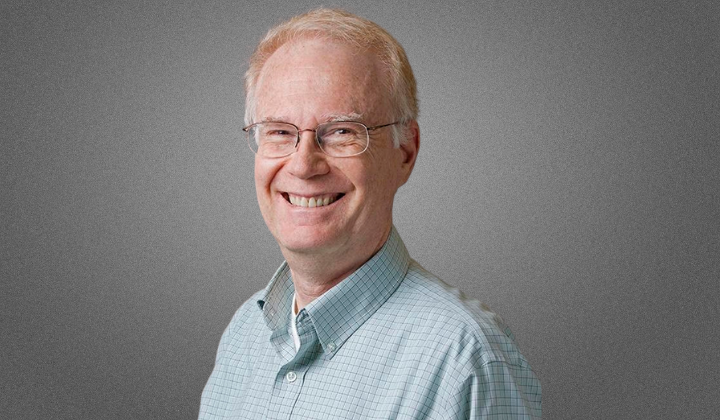 Photo of Barry, light blond hair, glasses, big smile