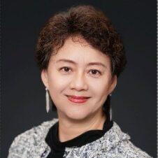 Amy Xia's headshot. She has short brown hair and is wearing a white jacket.