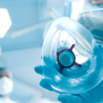 An anesthesiologist holding a breathing mask