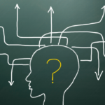 A graphic of a head with arrows going in different directions. There is a question mark inside the outline of the head.