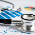 A stethoscope sitting on top of a printed graph.