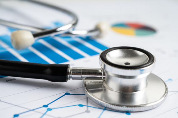 A stethoscope sitting on top of a printed graph.