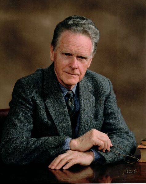 A white man with graying hair, in a suit jacket